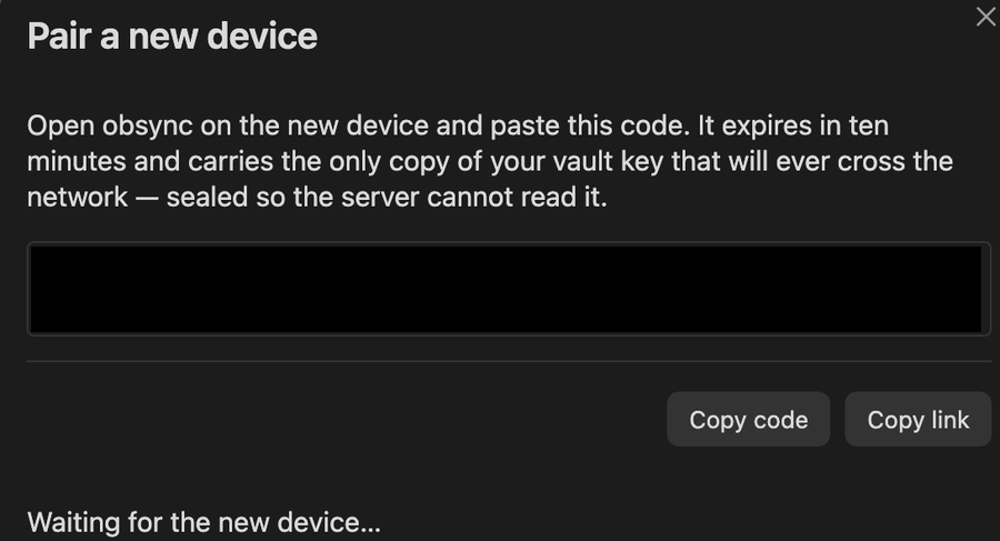 The Pair a new device dialog on the computer, its code blurred